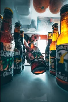 several bottles of beer sitting on top of a counter