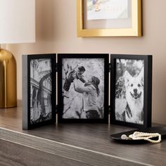 three black and white photos are on a shelf next to a gold framed photo frame