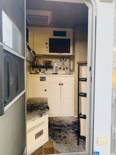 the inside of an rv with its door open