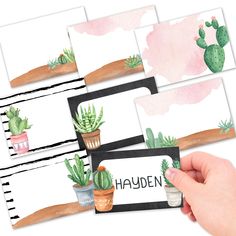 hand holding up four cards with watercolor cacti and succulents on them