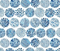 a blue and white pattern with swirls in the center, on a white background