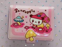 a pink and yellow plate with a cartoon character on it