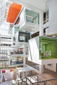 the inside of a building with many windows and balconies on each floor,