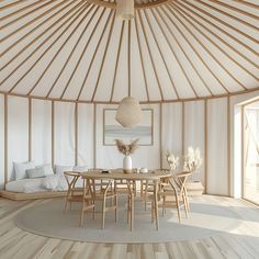 a dining table and chairs in the middle of a room with a round wooden floor