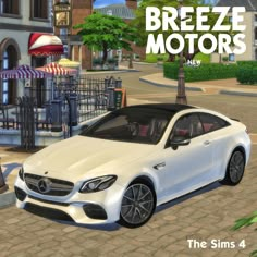 a white car parked in front of a building with the words breeze motors on it