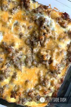 a casserole dish with meat and cheese on it