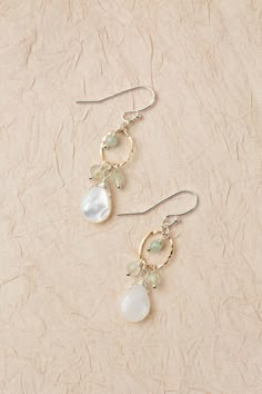 The Serenity Collection is beloved classic line from Anne Vaughan Designs. These mindfully crafted earrings are ideal for pairing with other items from the collection. Mixed Metal (nickel and lead-safe) Aquamarine, Prehnite, Mother Of Pearl 1.5", with sterling silver ear wires We hand select our natural materials, thus there may be slight variations in color and/or size that will not detract from the overall aesthetic Our unique handcrafted designer jewelry for women is made in America, each des Elegant Earrings With Natural Stones, Luxury Handmade Delicate Earrings, Delicate Handmade Earrings, Unique Jewelry Inspiration, Unique Pearl Earrings, Floyd Va, Diy Wire Jewelry Rings, Pearl Earrings Designs, Crafted Earrings