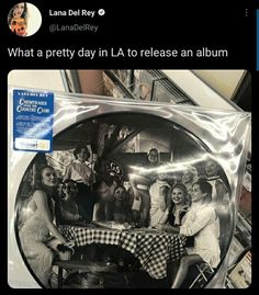 a group of women sitting at a table in front of a mirror with the caption what a pretty day in la to release an album