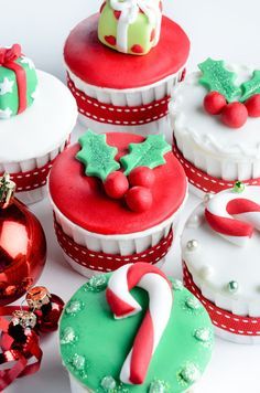 several decorated cupcakes sitting next to each other