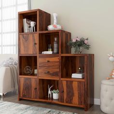 a shelving unit with drawers in a living room