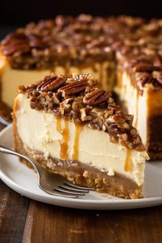 a slice of cheesecake with pecans on top