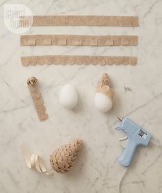 the supplies needed to make an ornament are laid out on a marble surface