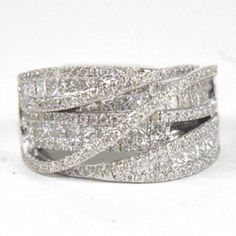 This Is A Fine Criss Cross Cluster Diamond Lady's Ring Band. It Is Made Of 100% Natural 14kt White Gold And Is In Brand New Condition. It Has A Ctw Of 2.09ct And Weighs 9.9 Grams. The Fancy Diamonds Have A Clarity Of Si1 And F Color. This Beautiful Custom Piece Has Excellent Round And Princess Cut Diamond Stones That Form Into A Bypass Criss Cross Design With Brilliant Diamond Accents. Samson Diamond Criss Cross Ring, Princess Cut Diamond, Fancy Diamonds, Cross Ring, Cross Design, Cross Designs, Princess Cut Diamonds, Ring Band, Brilliant Diamond