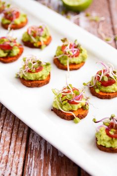 small appetizers with guacamole and red onion sprinkles