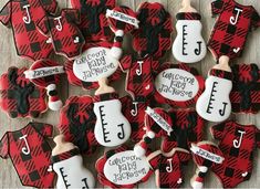 decorated cookies are arranged in the shape of guitars and guitar heads with name tags on them