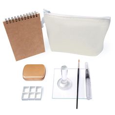 an assortment of office supplies including a pen, eraser, and pencil holder on a white background