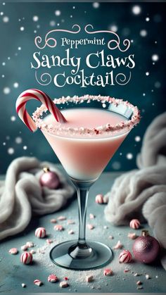 a pink cocktail with candy cane in it