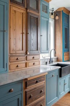 A charming country-style kitchen with a mix of wood and painted cabinets, a farmhouse sink, and rustic wooden beams on the ceiling. Cabinet Makeover Ideas, Kitchen Cabinet Makeover, Custom Built Ins, Kitchen Cabinets Makeover, Cabinet Makeover, Makeover Ideas