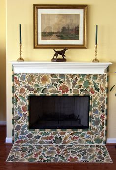 a fireplace with a painting on the wall above it