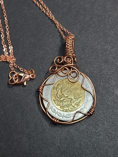 Copper wire wrapped howlite. The chain is copper and about 22 inches in length. The coin is a 1993 Mexican coin.  about half inch in diameter. The coin is about 1 in diameter. Handmade Metal Coin Necklace, Bijoux Fil Aluminium, Wrap Jewelry, Wire Necklace, Wire Weaving, Wire Wrapped Necklace, Coin Jewelry, Wrapped Jewelry, Coin Necklace