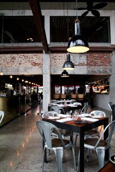 an empty restaurant with tables and chairs