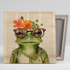 a frog wearing glasses and flowers on top of it's head, sitting in front of an open book