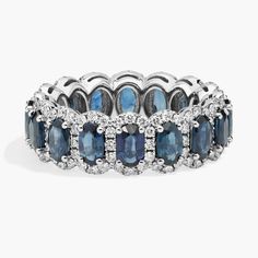 Brilliant blue sapphires nestle into individual diamond halos in this effervescent eternity ring and 14k white gold allows for maximum shine of the deeply hued stones. Printable Ring Sizer, Popular Rings, Precious Gemstones, Perfect Ring, Halo Diamond, Eternity Ring, Sapphire Ring, Blue Sapphire, Fashion Rings