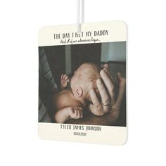 a baby's photo is hanging on a white tag that says, the day i let my daddy