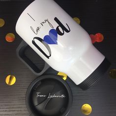 a personalized coffee mug with the word i love my dad on it and some confetti