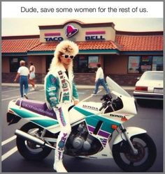 a woman sitting on top of a motorcycle in front of a taco bell store