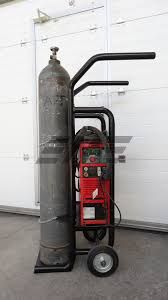 a fire extinguisher sitting in front of a garage door