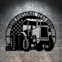 a tractor with an american flag on it is shown in front of a brick wall