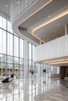 the lobby is clean and ready to be used for business or office use, with large windows