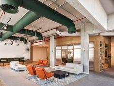 an office lobby with couches and chairs