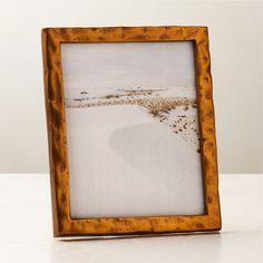 Handcrafted with a traditional sand-casting technique, metal picture frame features an organic silhouette full of raw, rough-hewn character. Adds an elegant vintage feel to the bedroom or entryway. Pair with the Abel mirror for a coordinated look. CB2 exclusive.Due to the nature of the material, brass patina will vary in color and darken over time.  -Handmade -Sand-cast aluminum frame -Sawtooth hangers for wall display -Easel back for tabletop display -Variations in texture and finish are to be Art On Wall, Marble Pictures, Brass Picture Frames, Metal Picture Frame, Brass Patina, Display Easel, Metal Picture Frames, Tabletop Display, Sand Casting