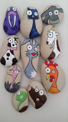 a group of rocks with cartoon characters painted on them