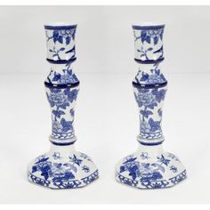 two blue and white vases sitting next to each other