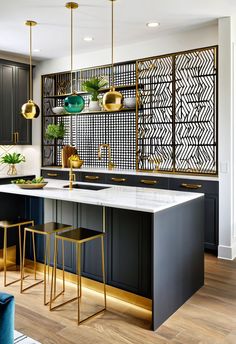 #MetalPartition #USAHomeDesign #OpenKitchenStyle #LuxuryInteriors #FunctionalDesign This upscale USA-inspired kitchen boasts a gold-accented metal screen partition that adds both elegance and privacy. Charcoal cabinets and quartz counters bring sleek sophistication, while vibrant decor adds warmth. Designed for those who appreciate luxury with function, this space feels bold and inviting. Charcoal Cabinets, Screen Partition, Vibrant Decor