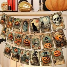 halloween cards hanging from a mantle with pumpkins and jack - o'- lanterns