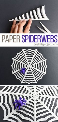 paper spider webs with purple flowers in the center and on each side, cut out from white paper