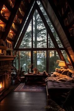 a living room filled with furniture and a fire place in front of a large window