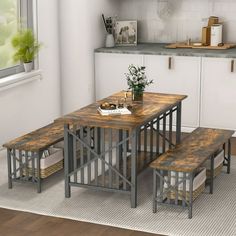 a table and benches in a small kitchen