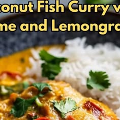 a close up of a plate of food with rice and fish curry on the side