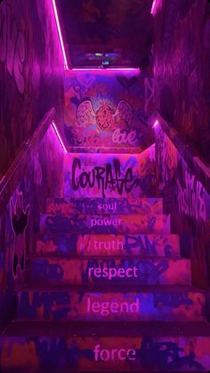 the stairs are covered in graffiti and lit up with purple light, while the walls have been