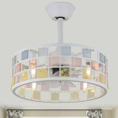 a light fixture hanging from the ceiling in a room