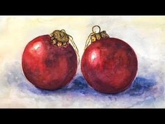 two red pomegranates sitting side by side