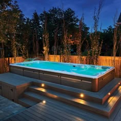 a hot tub sitting on top of a wooden deck