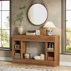 a wooden table with a mirror on top of it and some books in front of it