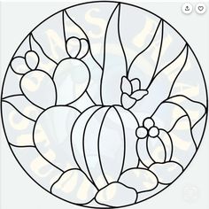 a circular stained glass window with flowers and leaves