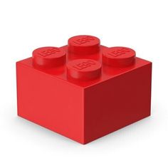 a red lego block with four small round holes